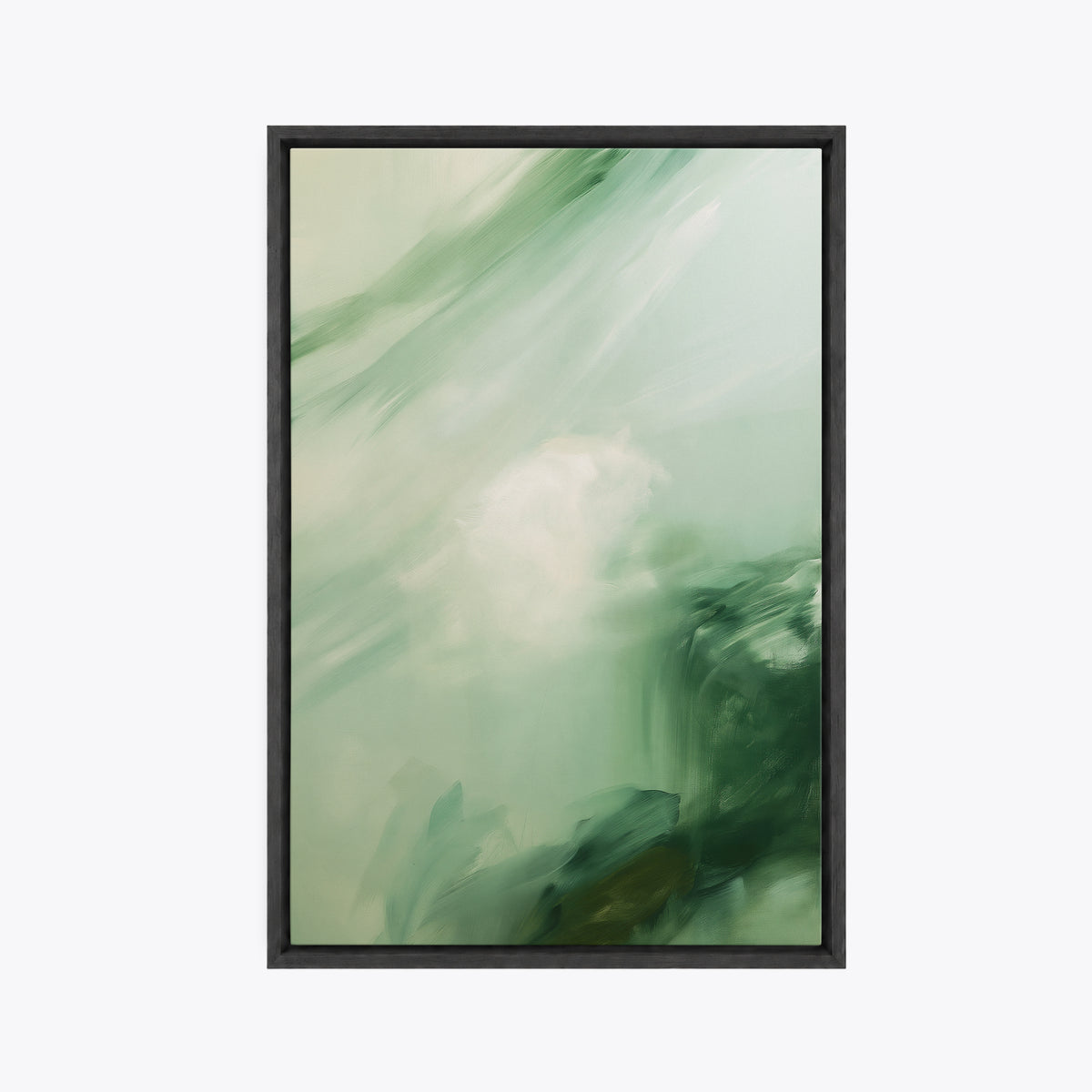 Tableau décoratif abstrait vert en cadre noir, vu de face, touches de vert profond autour d'une tache claire